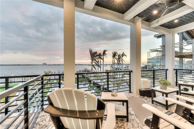 balcony at dusk with a water view