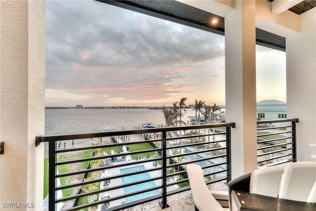 balcony at dusk with a water view