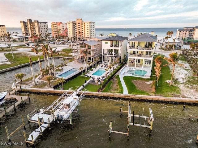 birds eye view of property featuring a water view