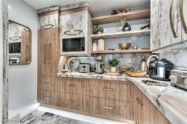 kitchen featuring tasteful backsplash, black microwave, open shelves, brown cabinets, and modern cabinets