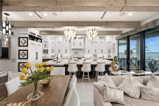 dining area featuring recessed lighting, light tile patterned floors, and beamed ceiling