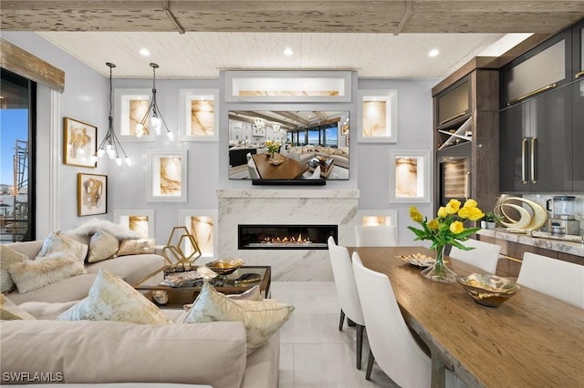 living area with wood ceiling, a high end fireplace, tile patterned flooring, and recessed lighting
