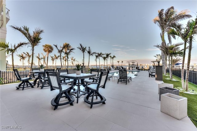 view of patio featuring fence and a community pool