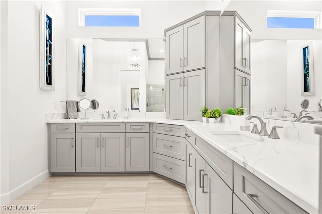 bathroom featuring vanity and a shower with door