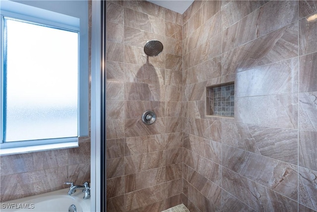 bathroom with shower with separate bathtub