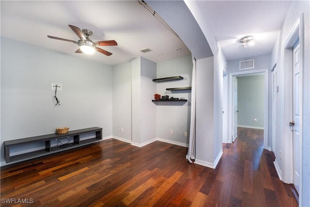 interior space featuring ceiling fan and dark hardwood / wood-style floors