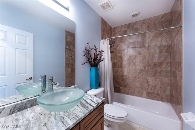 full bathroom featuring toilet, vanity, and shower / bathtub combination with curtain