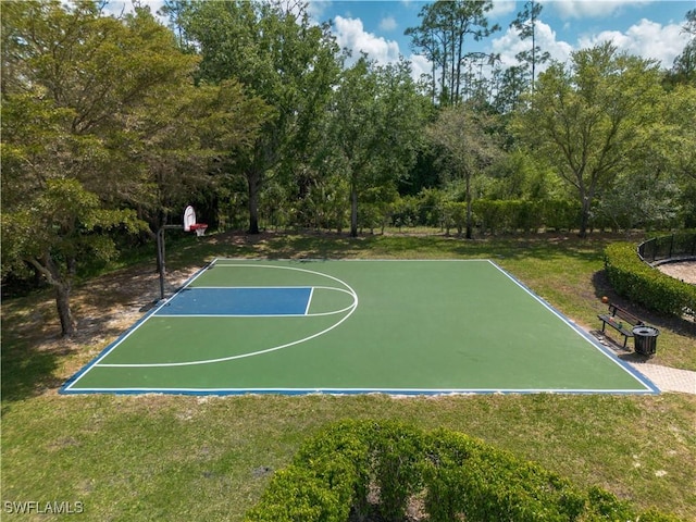 view of basketball court featuring a lawn