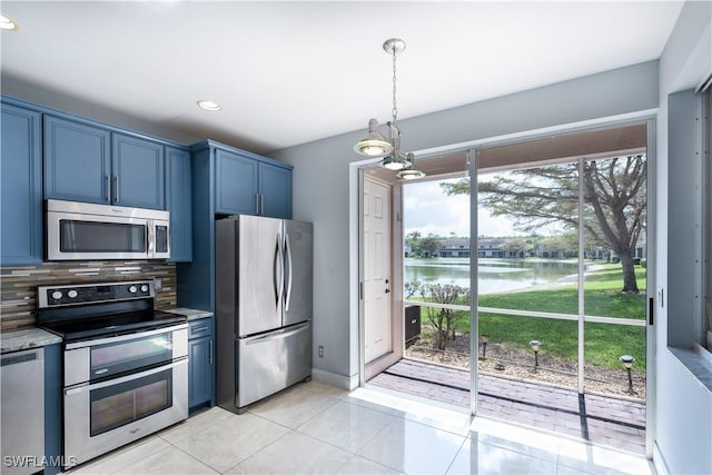 kitchen with stainless steel appliances, decorative backsplash, light tile patterned flooring, blue cabinets, and a water view