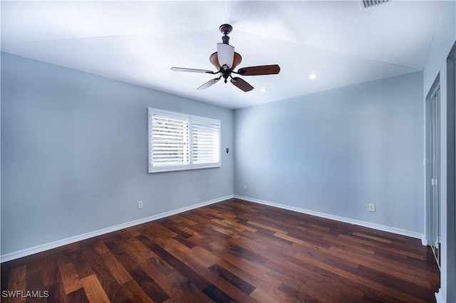 spare room featuring ceiling fan and dark hardwood / wood-style floors