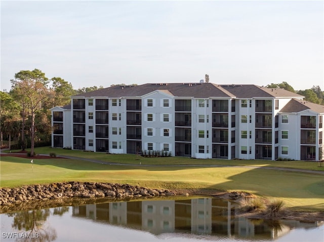 view of building exterior featuring a water view