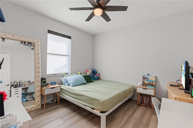 bedroom featuring ceiling fan and light wood-type flooring