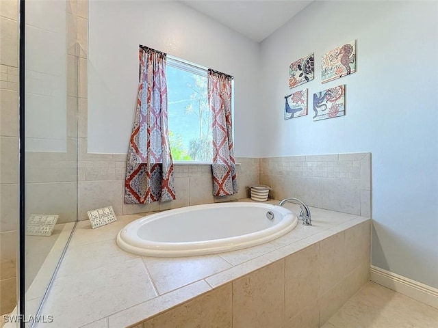 bathroom with tiled tub