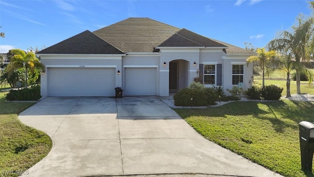 single story home featuring a garage and a front lawn