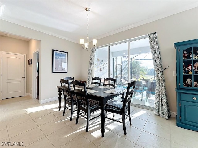 dining area with crown molding, light tile patterned floors, and a notable chandelier