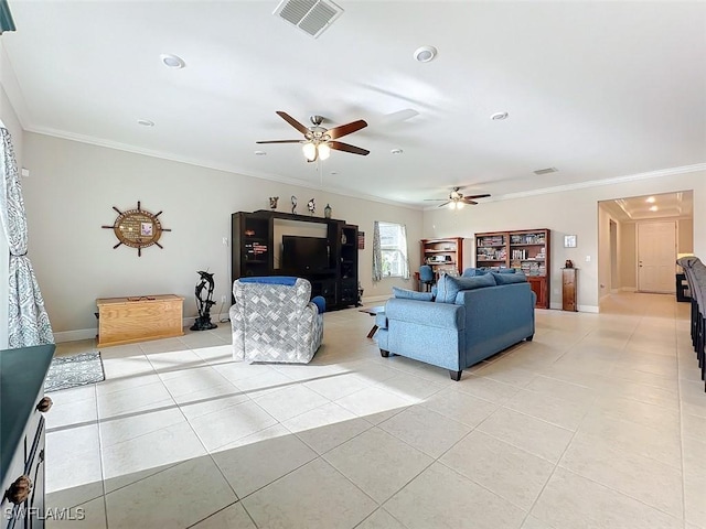 living room with ceiling fan, light tile patterned flooring, and ornamental molding