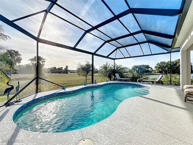 view of swimming pool with glass enclosure and a patio