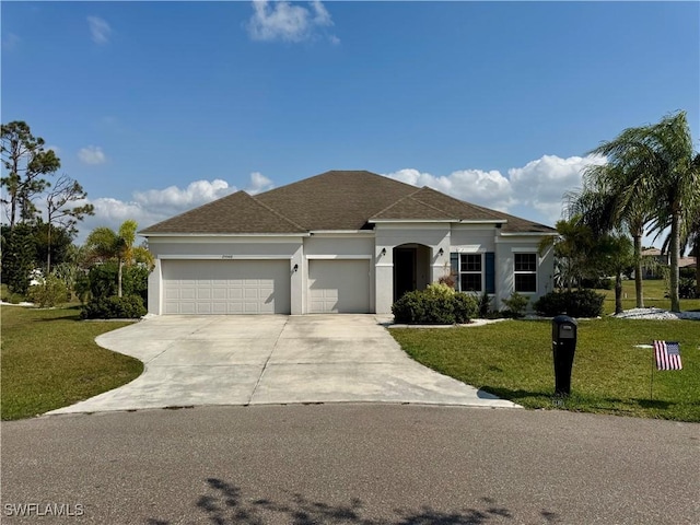 view of front of home with a shingled roof, concrete driveway, an attached garage, a front yard, and stucco siding