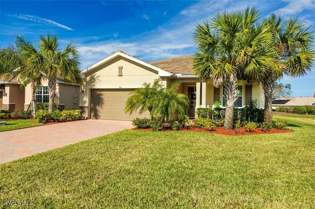 3101 E Windsor Dr, Alva, FL 33920 - ranch-style home with decorative driveway, stucco siding, a front lawn, and a garage