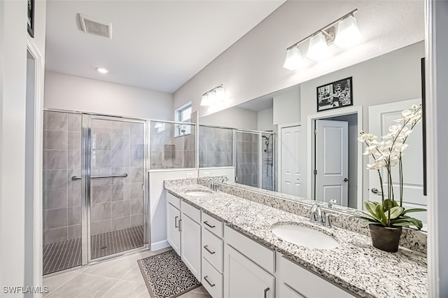 3101 E Windsor Dr, Alva, FL 33920 - bathroom featuring a stall shower, double vanity, and tile patterned floors