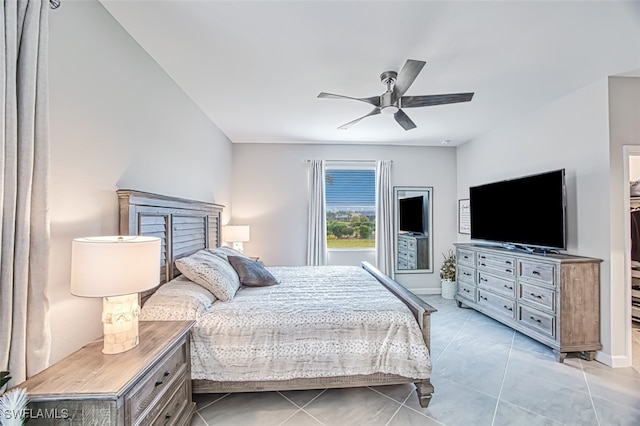 bedroom featuring light tile patterned floors and ceiling fan