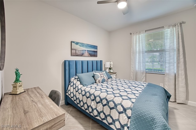 tiled bedroom with ceiling fan