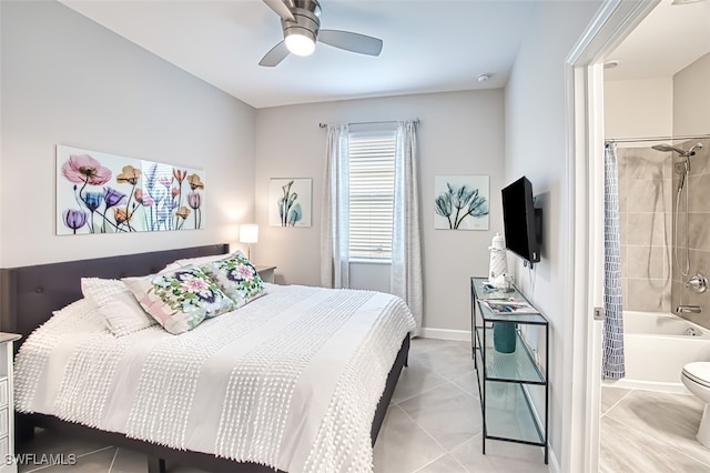 tiled bedroom featuring connected bathroom and ceiling fan