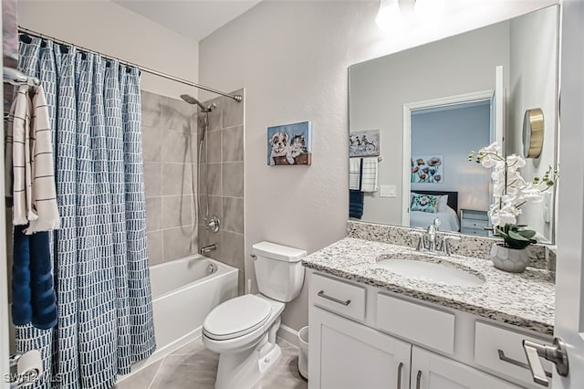 full bathroom with tile patterned flooring, vanity, shower / tub combo, and toilet