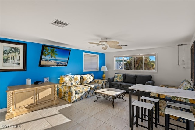 living room with light tile patterned floors and ceiling fan