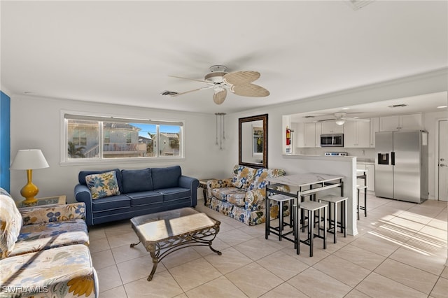 tiled living room featuring crown molding and ceiling fan