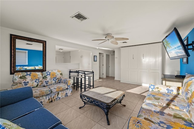 201 Miramar St, Fort Myers Beach, FL 33931 - living room featuring ornamental molding, light tile patterned flooring, visible vents, and a ceiling fan