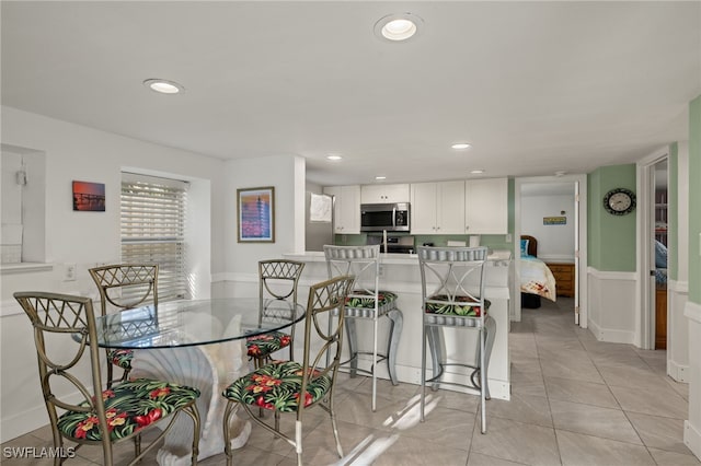 201 Miramar St, Fort Myers Beach, FL 33931 - dining area with light tile patterned floors and recessed lighting