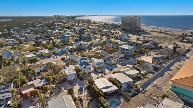 bird's eye view featuring a water view and a view of the beach