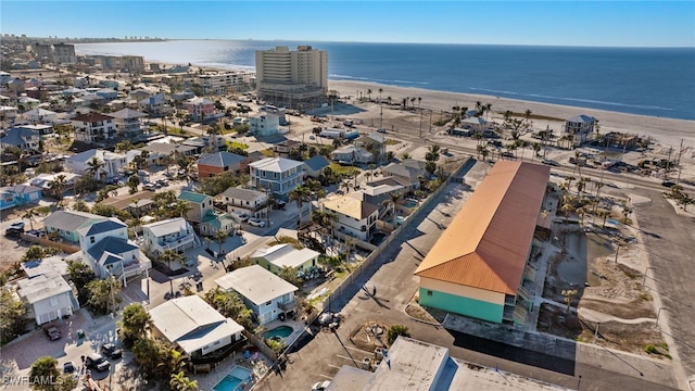 bird's eye view with a water view and a view of the beach