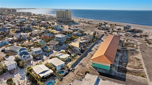 aerial view featuring a water view and a view of the beach