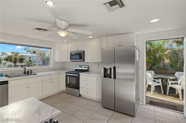 201 Miramar St, Fort Myers Beach, FL 33931 - kitchen with appliances with stainless steel finishes, visible vents, recessed lighting, and a sink