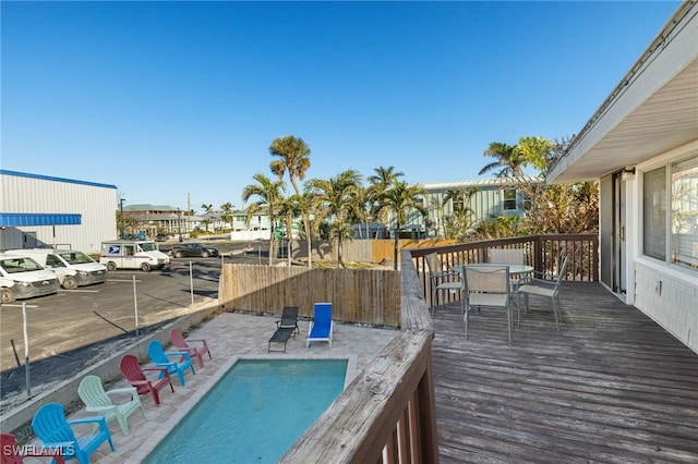 201 Miramar St, Fort Myers Beach, FL 33931 - view of pool featuring outdoor dining area, a fenced in pool, a wooden deck, and fence