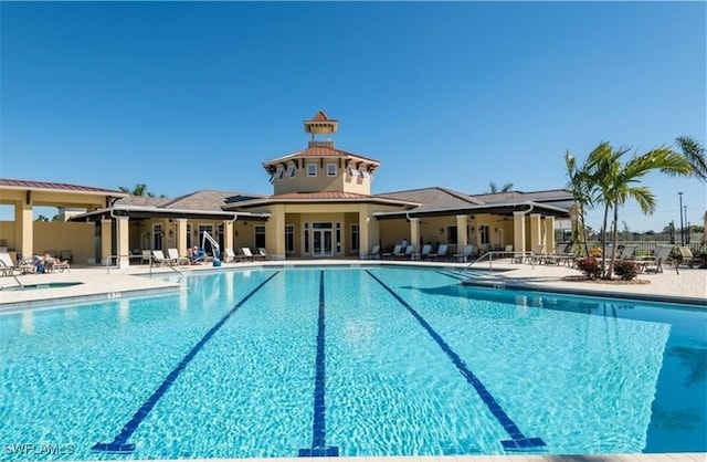 view of swimming pool featuring a patio area