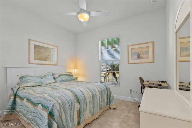 tiled bedroom featuring ceiling fan