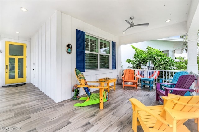 wooden deck with ceiling fan and covered porch