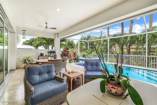 exterior space with a lanai and a pool with hot tub