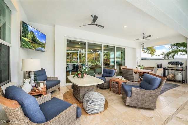 view of patio / terrace with an outdoor living space and ceiling fan