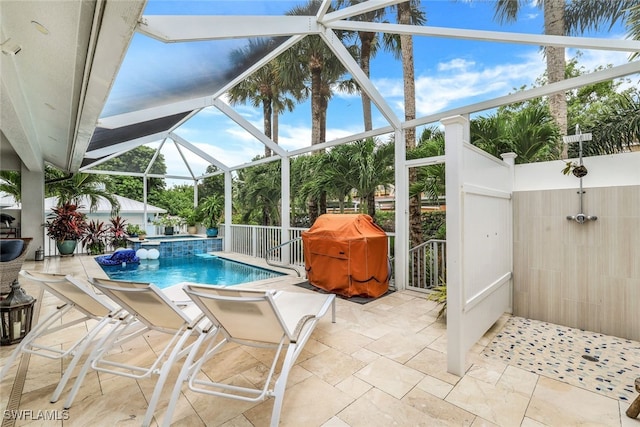 view of swimming pool with a grill, an in ground hot tub, glass enclosure, and a patio