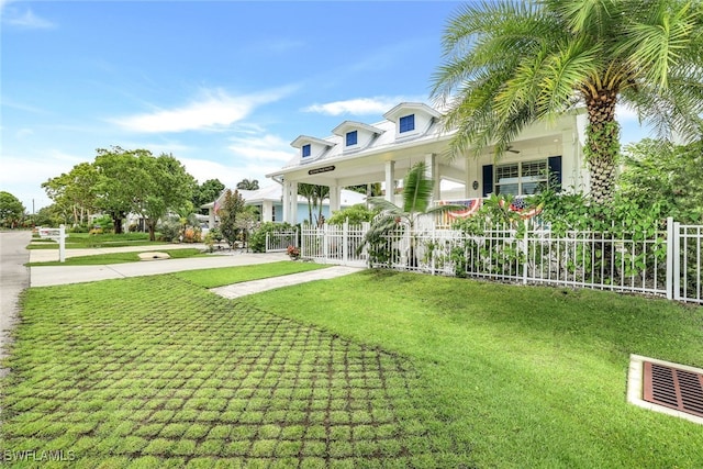 view of yard featuring covered porch