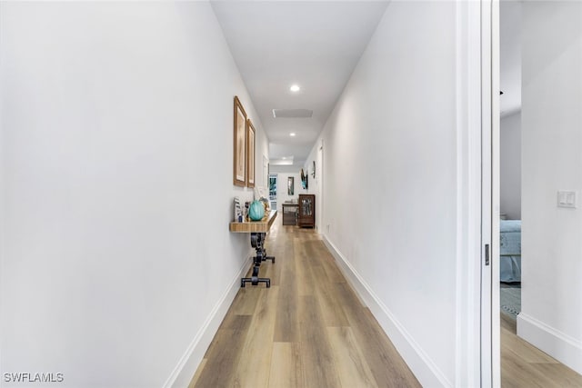 corridor featuring light hardwood / wood-style flooring