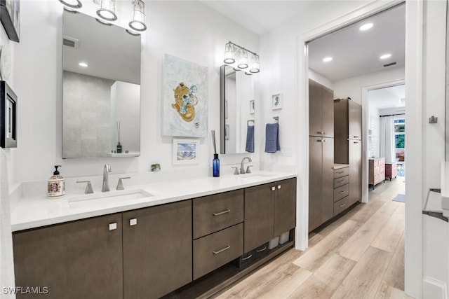 bathroom featuring vanity and wood-type flooring