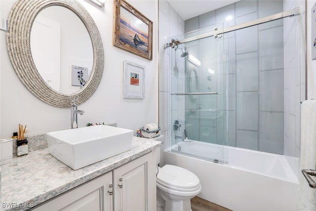 full bathroom featuring vanity, toilet, and enclosed tub / shower combo