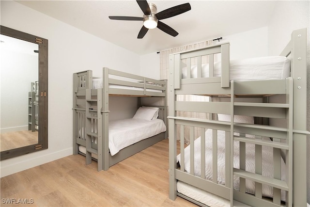 bedroom with light hardwood / wood-style flooring and ceiling fan