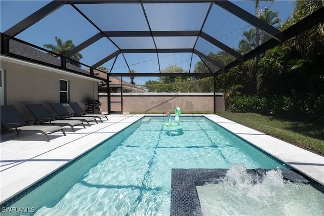 view of swimming pool with area for grilling, a lanai, and a patio