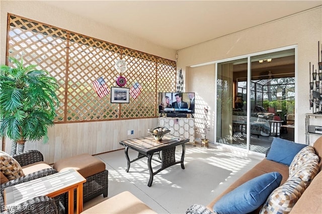 interior space featuring wood walls and concrete flooring